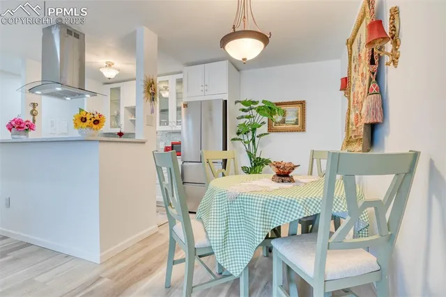 a dining room with furniture and window