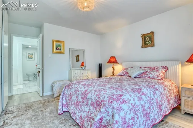 a bedroom with a bed and a view of bathroom