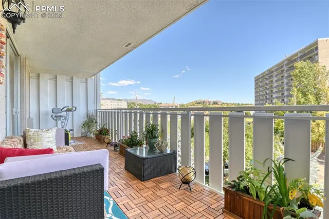 a balcony view with a potted plant and outdoor space