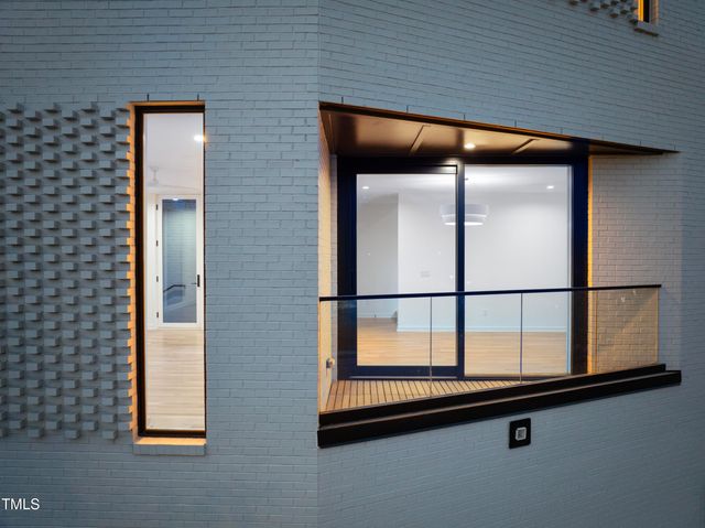 a bed room with a bed and a chair