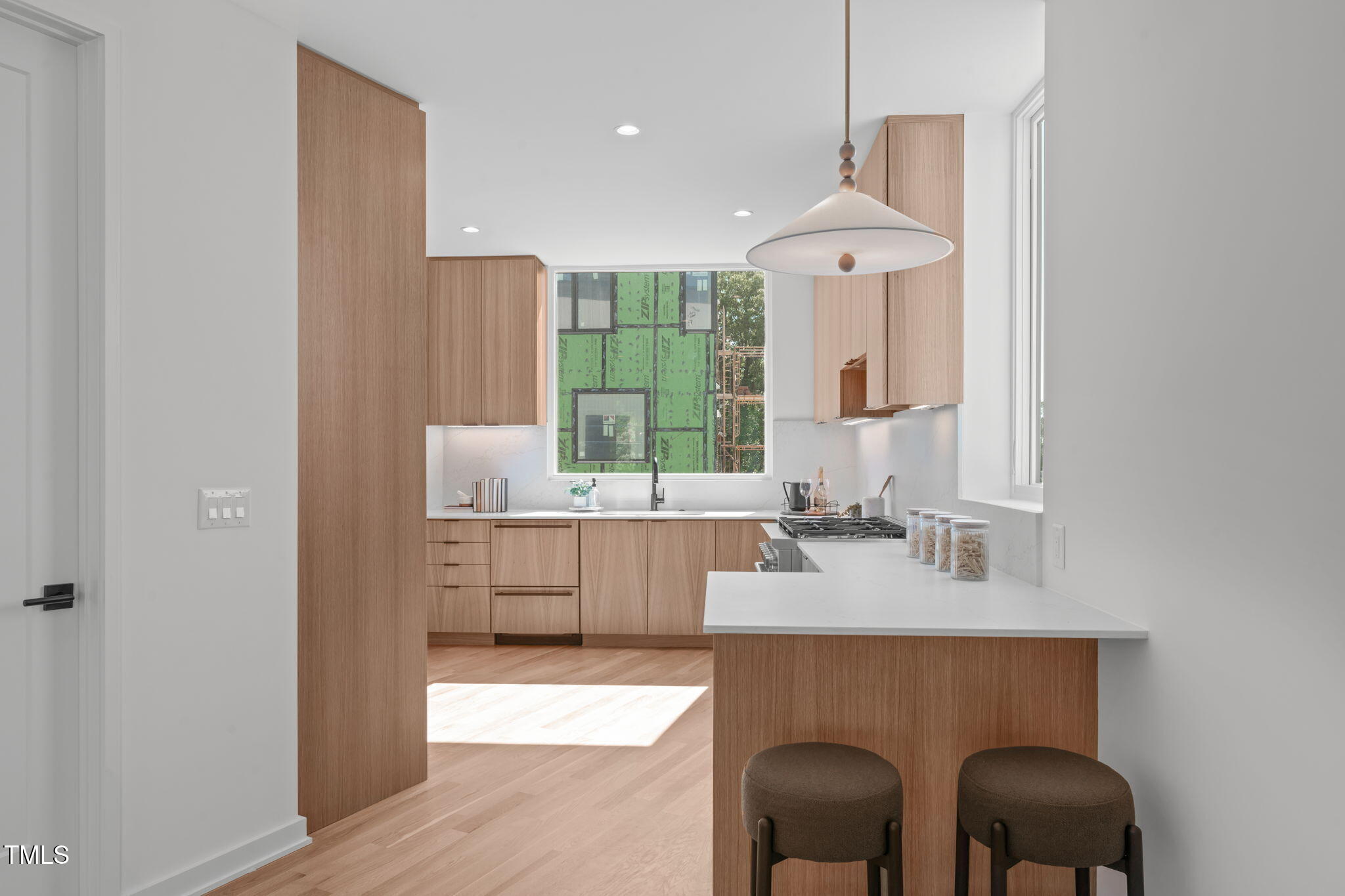 1308 Chamblee Hill Raleigh, NC 27608 - Photo 19 of 50 a kitchen with a sink cabinets and window