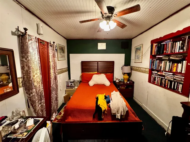 a bed room with a bed and a book shelf
