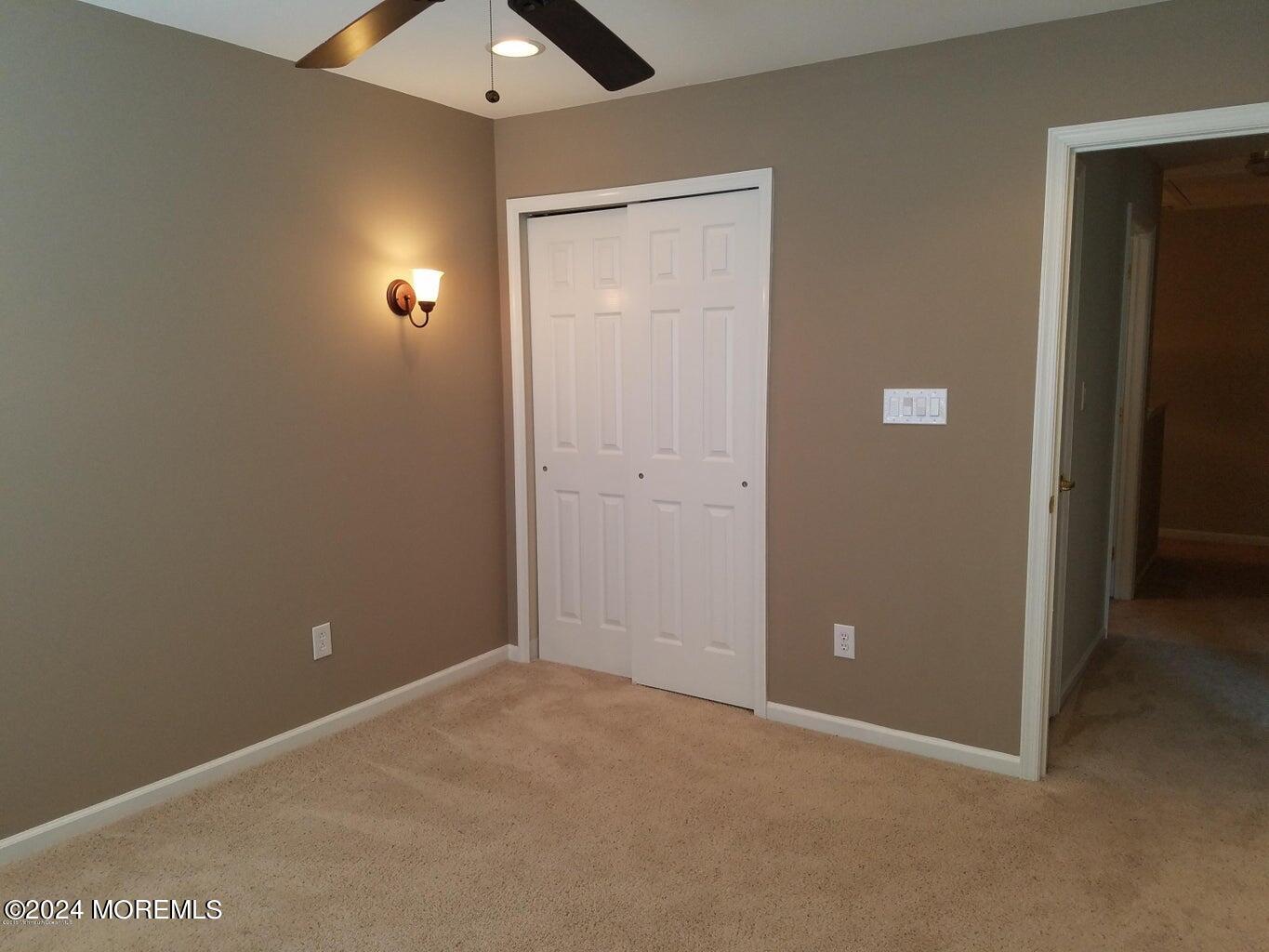 150 Brookfield Drive Jackson, NJ 08527 - Photo 20 of 41 an empty room with closet and windows