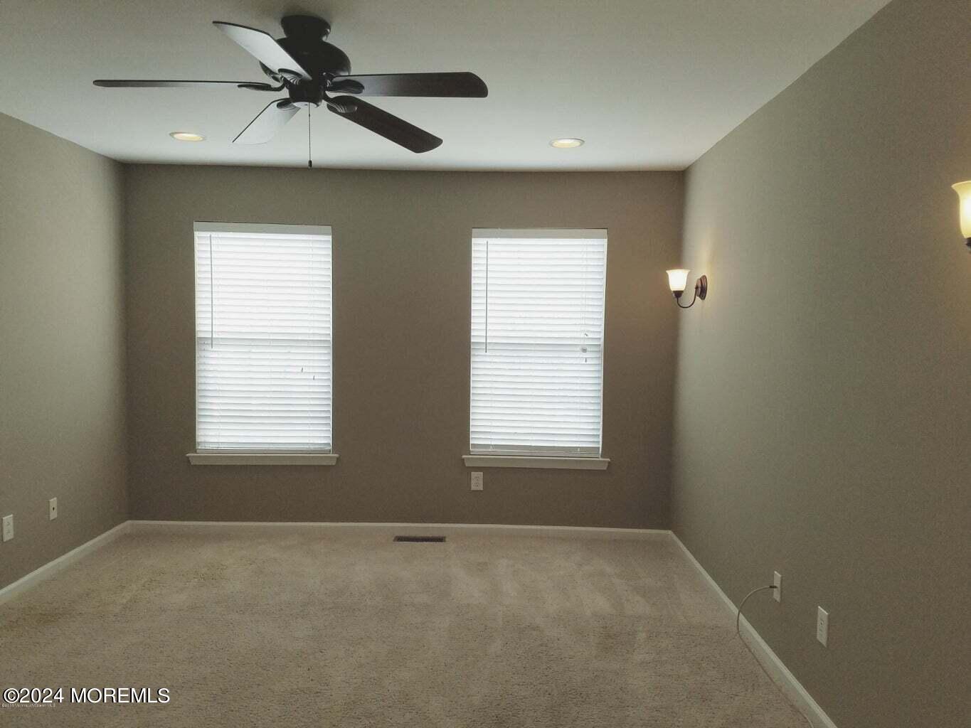 150 Brookfield Drive Jackson, NJ 08527 - Photo 27 of 41 an empty room with a window and a fan