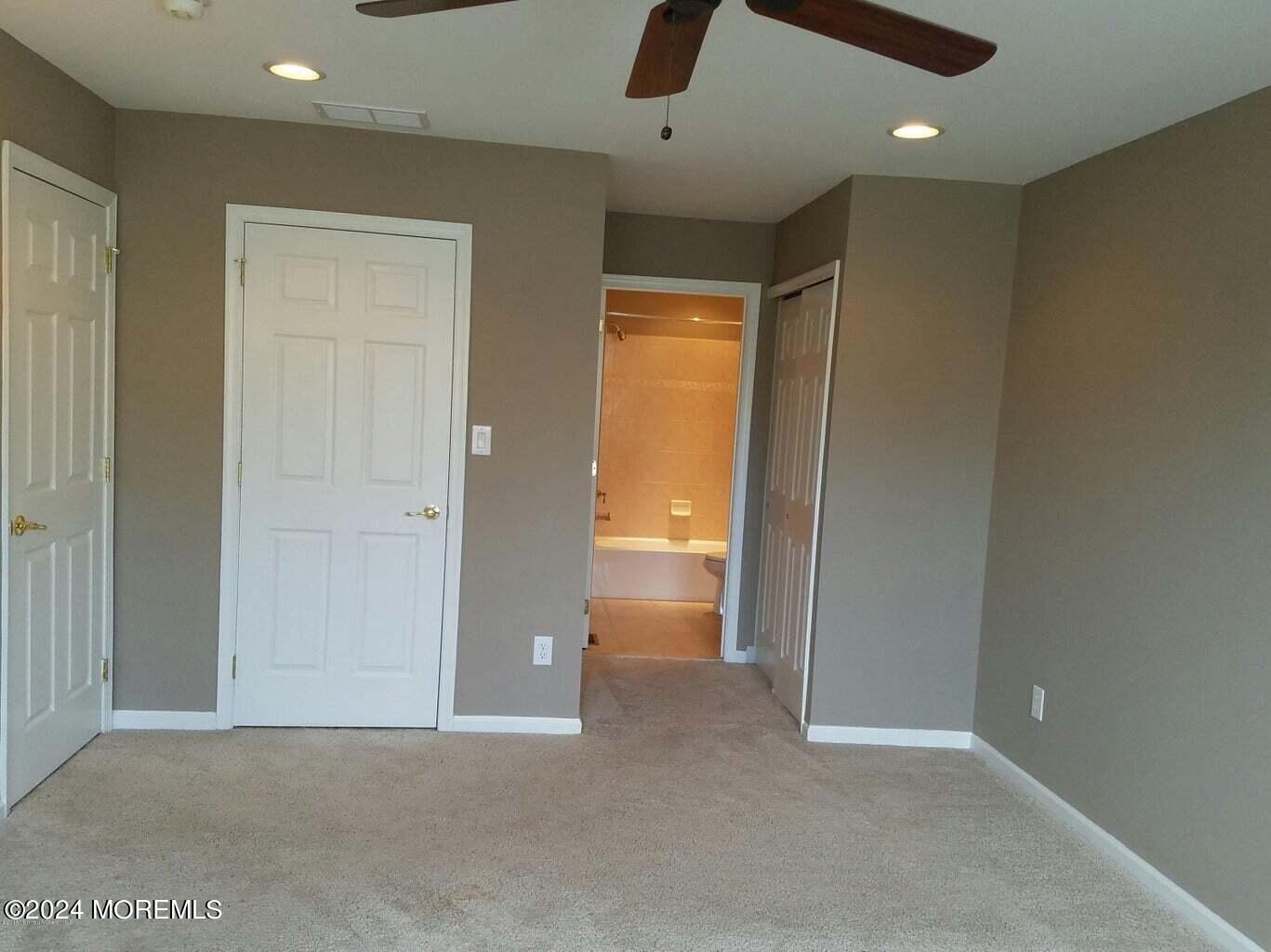 150 Brookfield Drive Jackson, NJ 08527 - Photo 32 of 41 an empty room with closet and windows