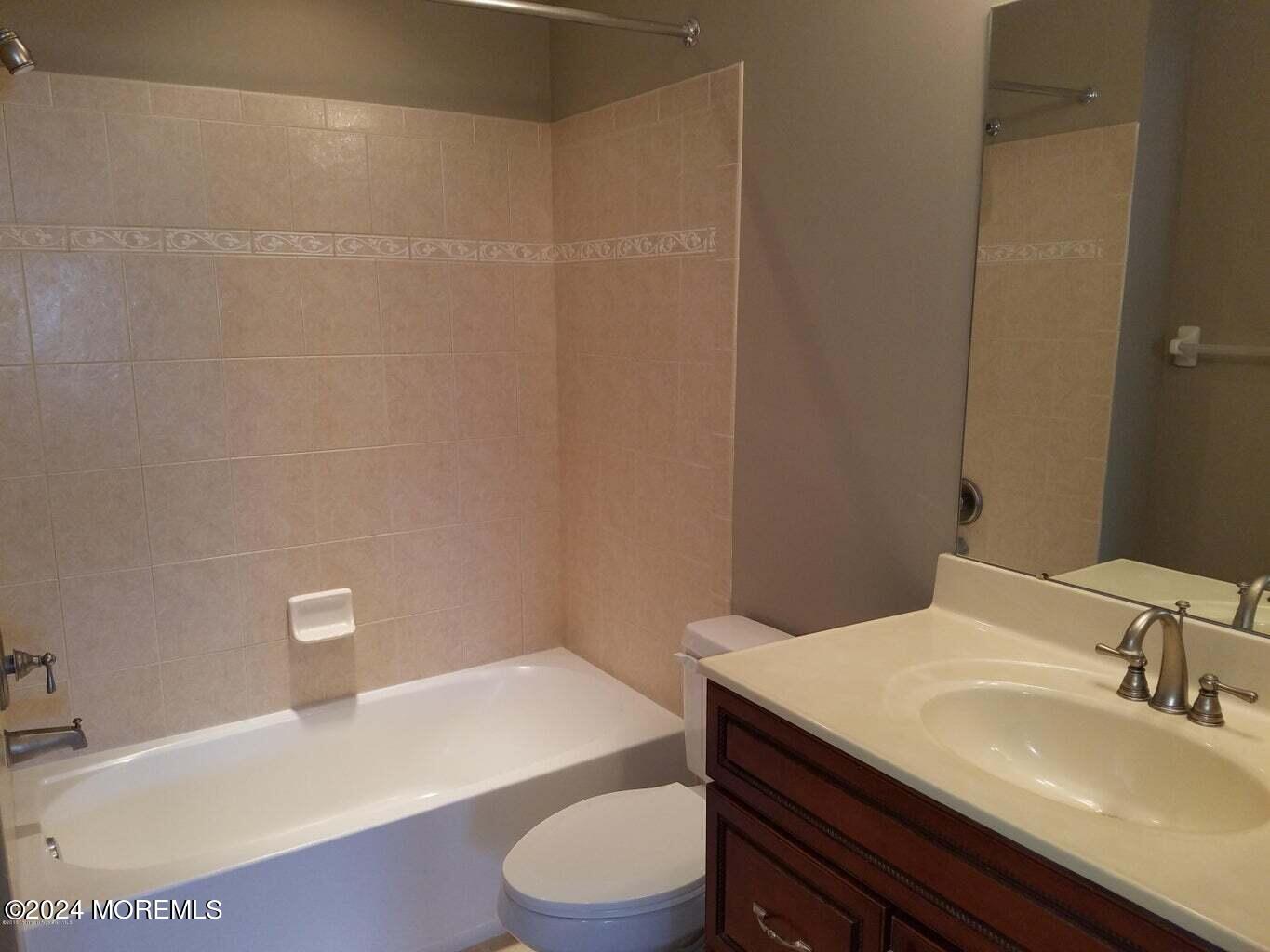 150 Brookfield Drive Jackson, NJ 08527 - Photo 33 of 41 a bathroom with a sink a toilet and tub