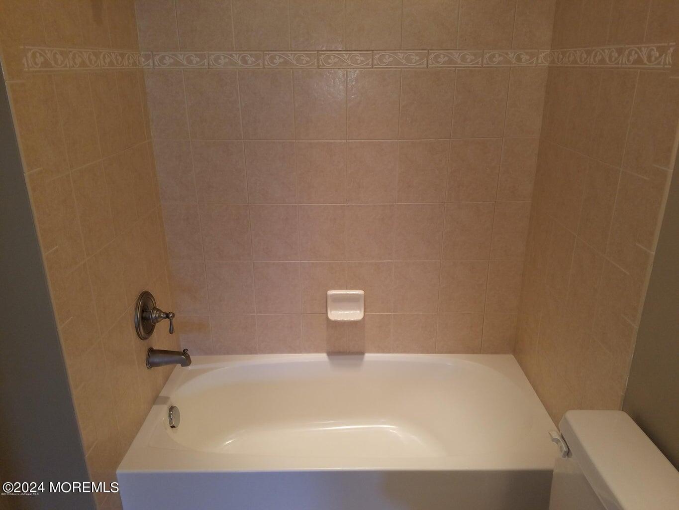 150 Brookfield Drive Jackson, NJ 08527 - Photo 36 of 41 a bathroom with a bathtub