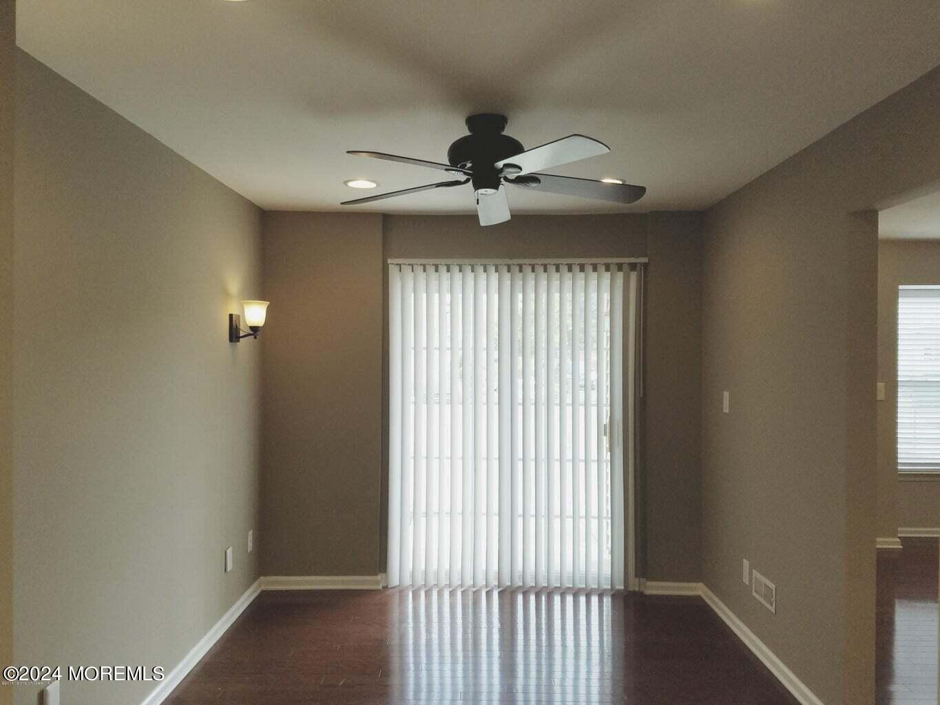 150 Brookfield Drive Jackson, NJ 08527 - Photo 6 of 41 a view of a livingroom with a ceiling fan and window