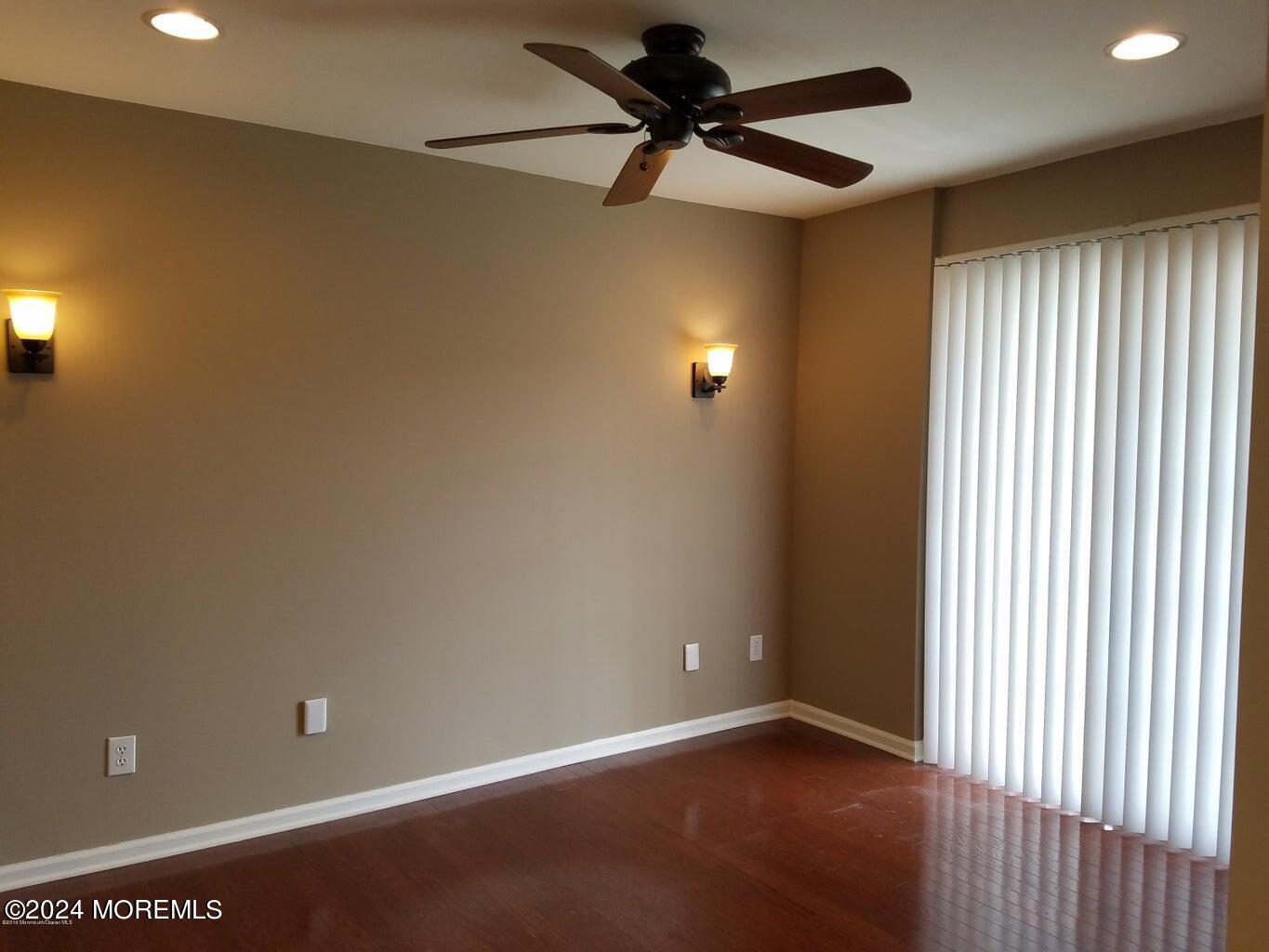 150 Brookfield Drive Jackson, NJ 08527 - Photo 7 of 41 an empty room with a ceiling fan and a window