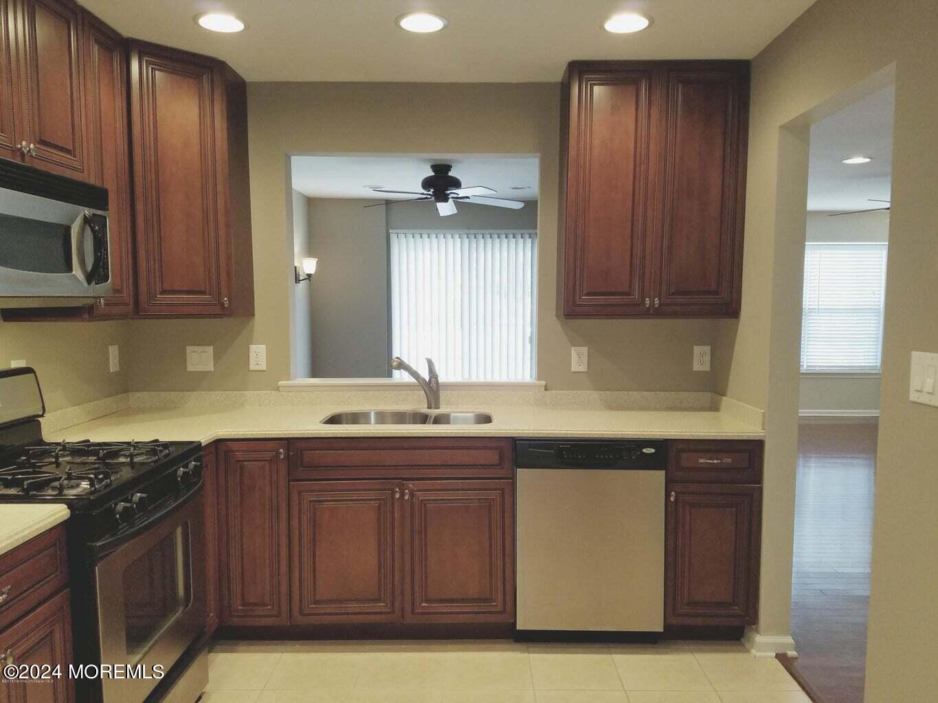 150 Brookfield Drive Jackson, NJ 08527 - Photo 10 of 41 a kitchen with a sink and cabinets