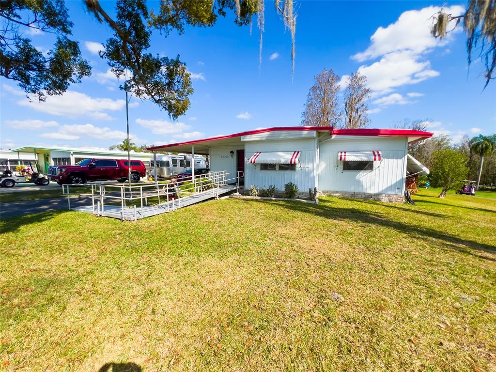 29129 Johnston Road, Unit 2557 Dade City, FL 33523 - Photo 13 of 13 a view of a swimming pool with seating area