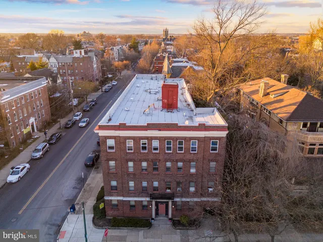 a front view of a building with garden