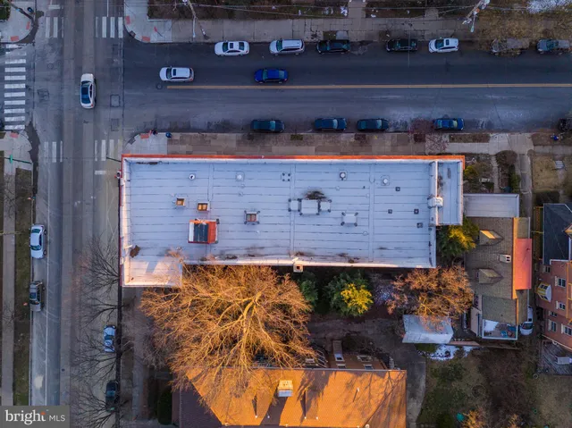 a living room with furniture a rug and a window