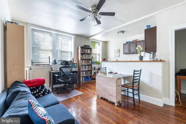 a kitchen with a white stove top oven and refrigerator