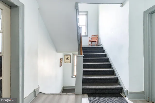 a narrow alley leading to a building