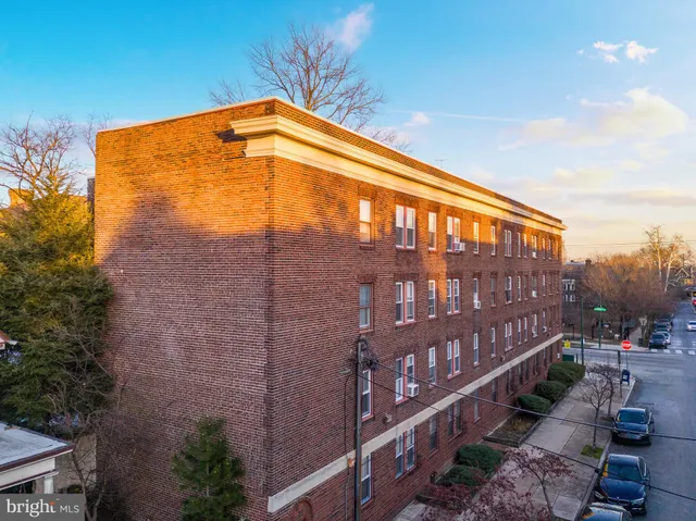 an aerial view of residential houses with city view