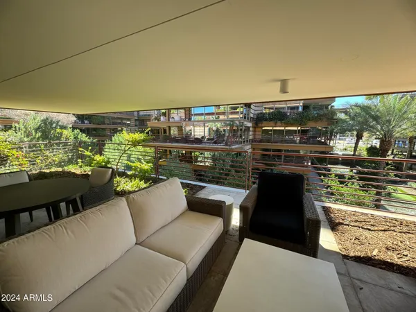 a view of balcony with furniture