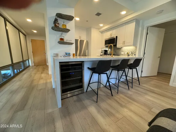 a view of kitchen with cabinets and wooden floor