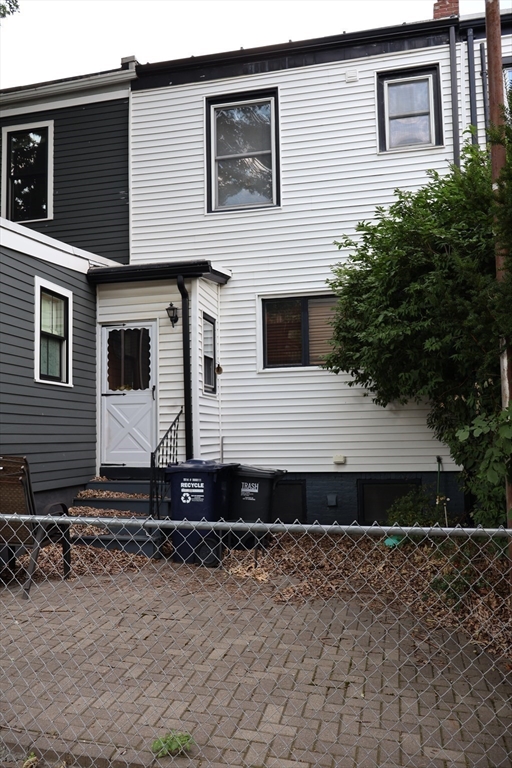 56 Spring Street Cambridge, MA 02141 - Photo 2 of 2 a front view of a house with trees