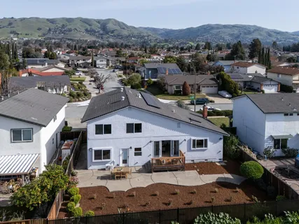 an aerial view of a house with a garden