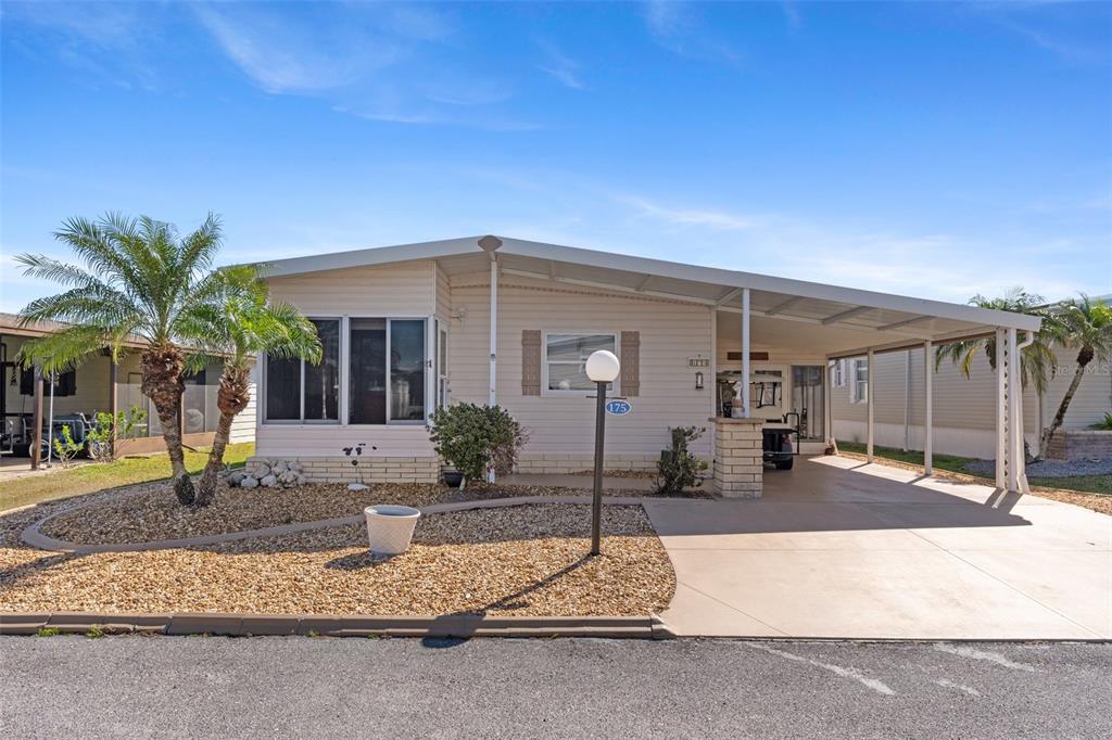 a front view of a house with a patio