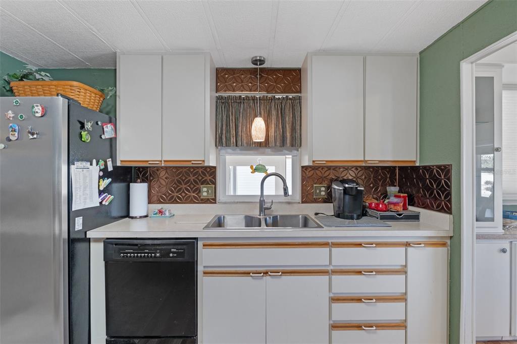 175 Martinique Road North Port, FL 34287 - Photo 14 of 82 a kitchen with stainless steel appliances granite countertop a sink stove and cabinets