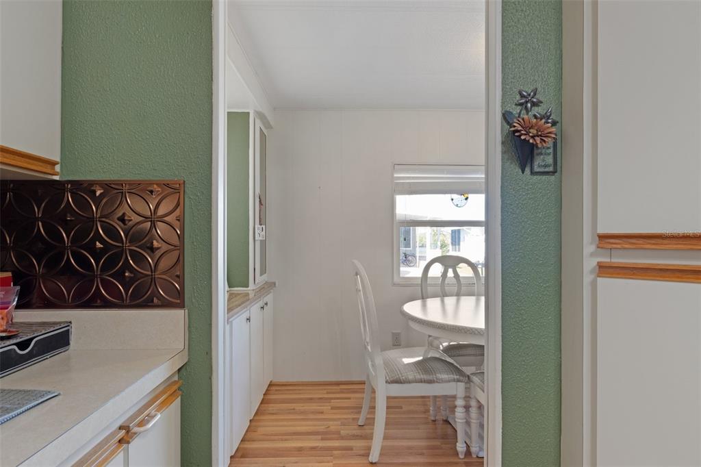 175 Martinique Road North Port, FL 34287 - Photo 15 of 82 a walk in closet with wooden floor