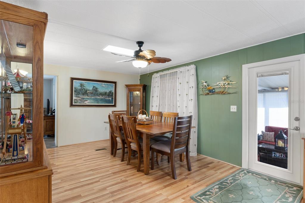 175 Martinique Road North Port, FL 34287 - Photo 25 of 82 a view of a dining room with furniture and wooden floor