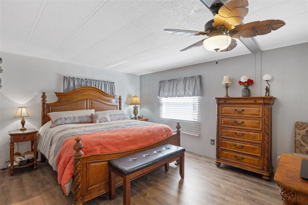 175 Martinique Road North Port, FL 34287 - Photo 29 of 82 a bedroom with a bed and wooden floor