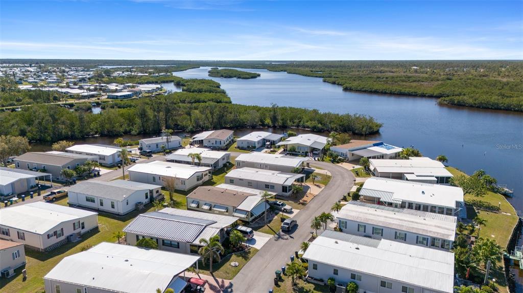 175 Martinique Road North Port, FL 34287 - Photo 41 of 82 an aerial view of a city with lots of residential buildings and lake view