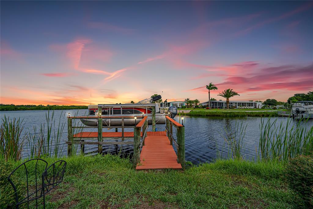 175 Martinique Road North Port, FL 34287 - Photo 80 of 82 a view of a lake with houses