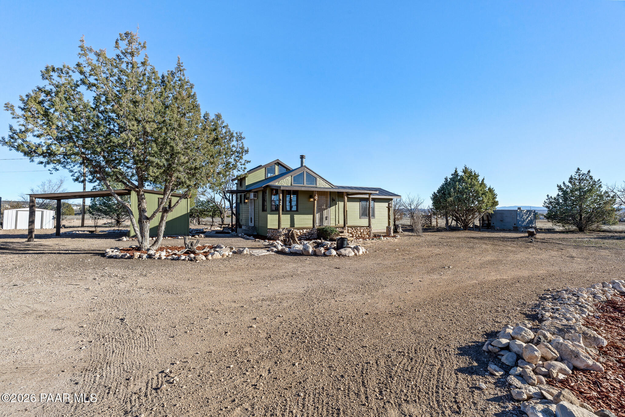 685 West Iris Road Paulden, AZ 86334 - Photo 26 of 33 a view of a house with a yard and sitting area