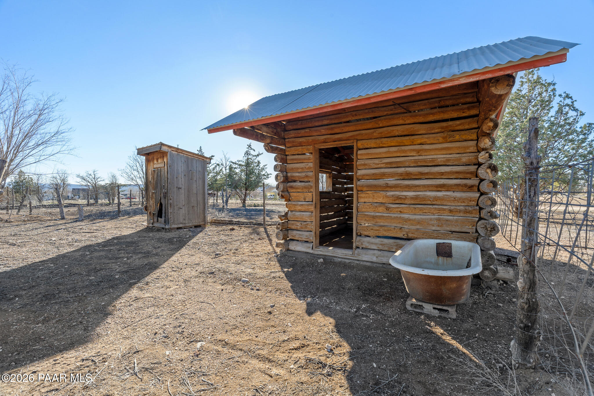 685 West Iris Road Paulden, AZ 86334 - Photo 27 of 33 a front view of a house with barbeque and wooden fence