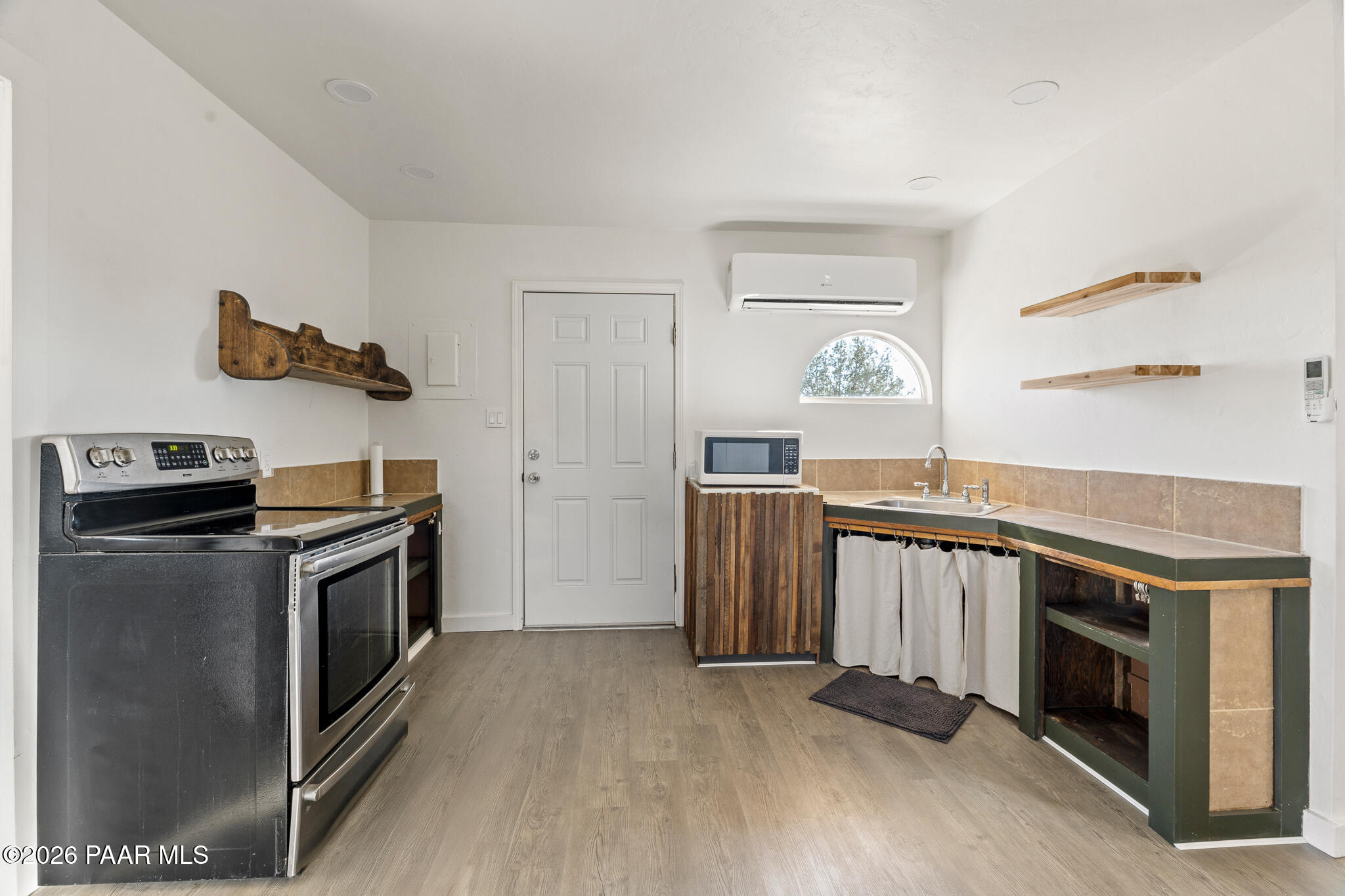 685 West Iris Road Paulden, AZ 86334 - Photo 5 of 33 a kitchen with a stove and a microwave