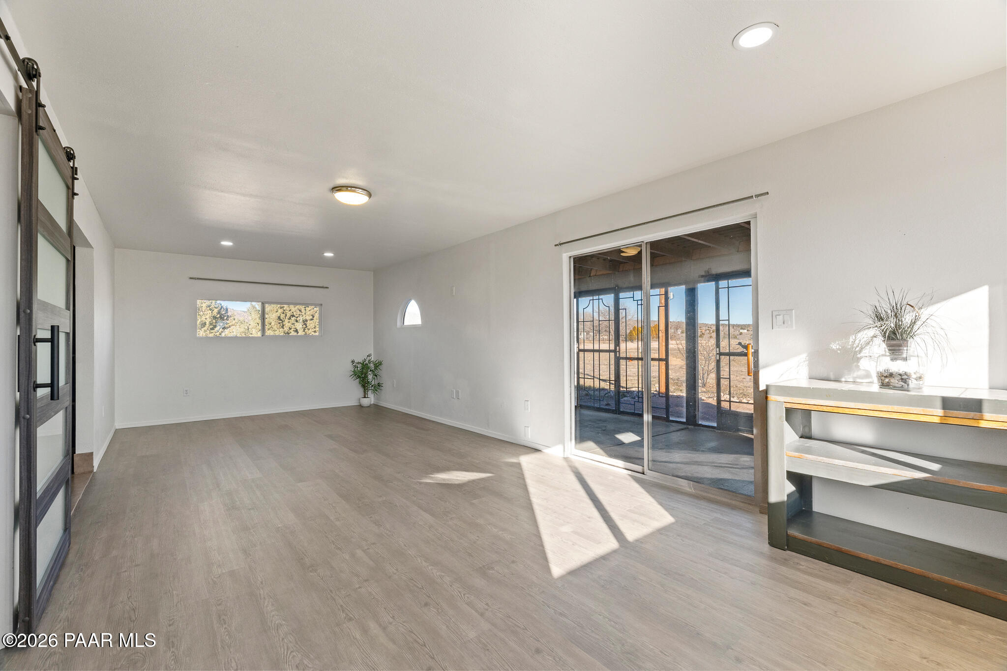 685 West Iris Road Paulden, AZ 86334 - Photo 8 of 33 a view of empty room with wooden floor and fan