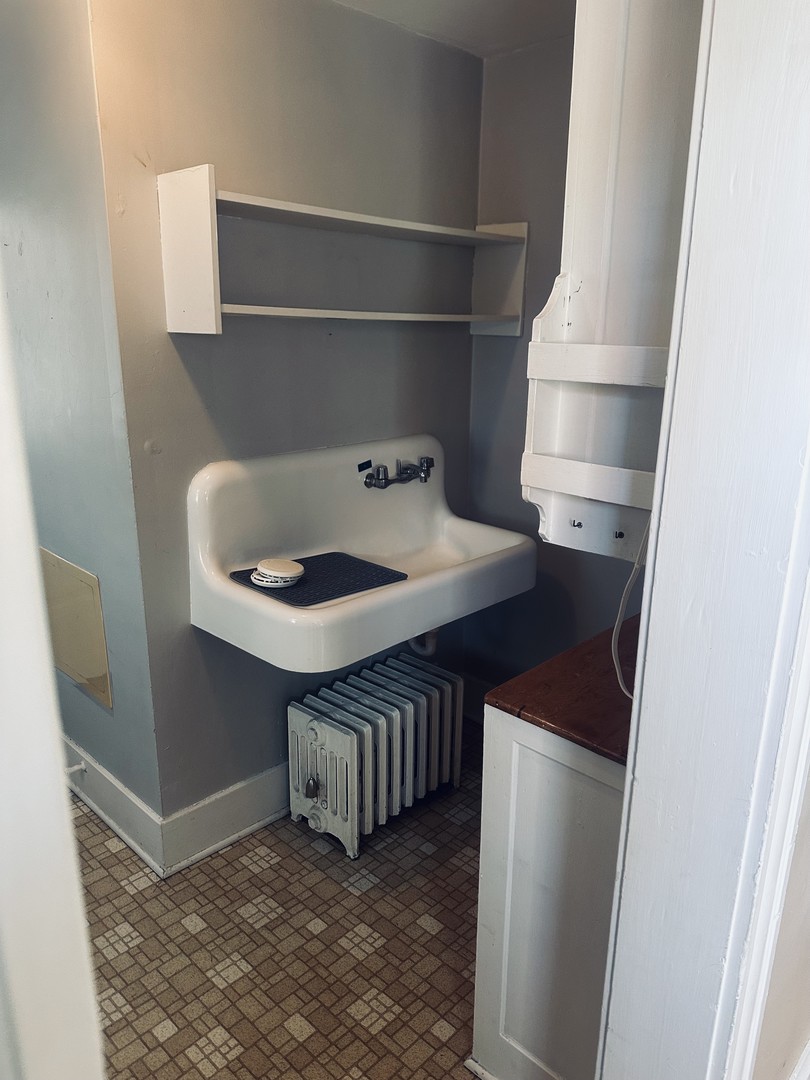 330 West Sycamore Street, Unit 2E Sycamore, IL 60178 - Photo 6 of 8 a kitchen with a sink and a refrigerator