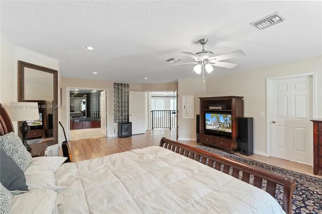 a view of a chairs and table in the balcony