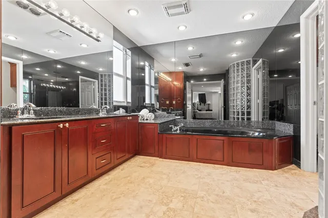 a view of a swimming pool with a dining space