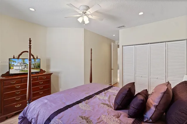 an aerial view of a houses with a lake view