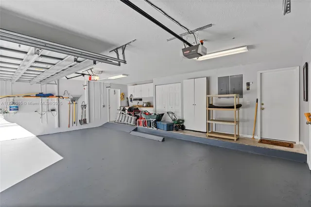 an aerial view of a houses with a lake view