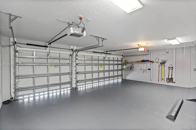 an aerial view of a houses with a swimming pool