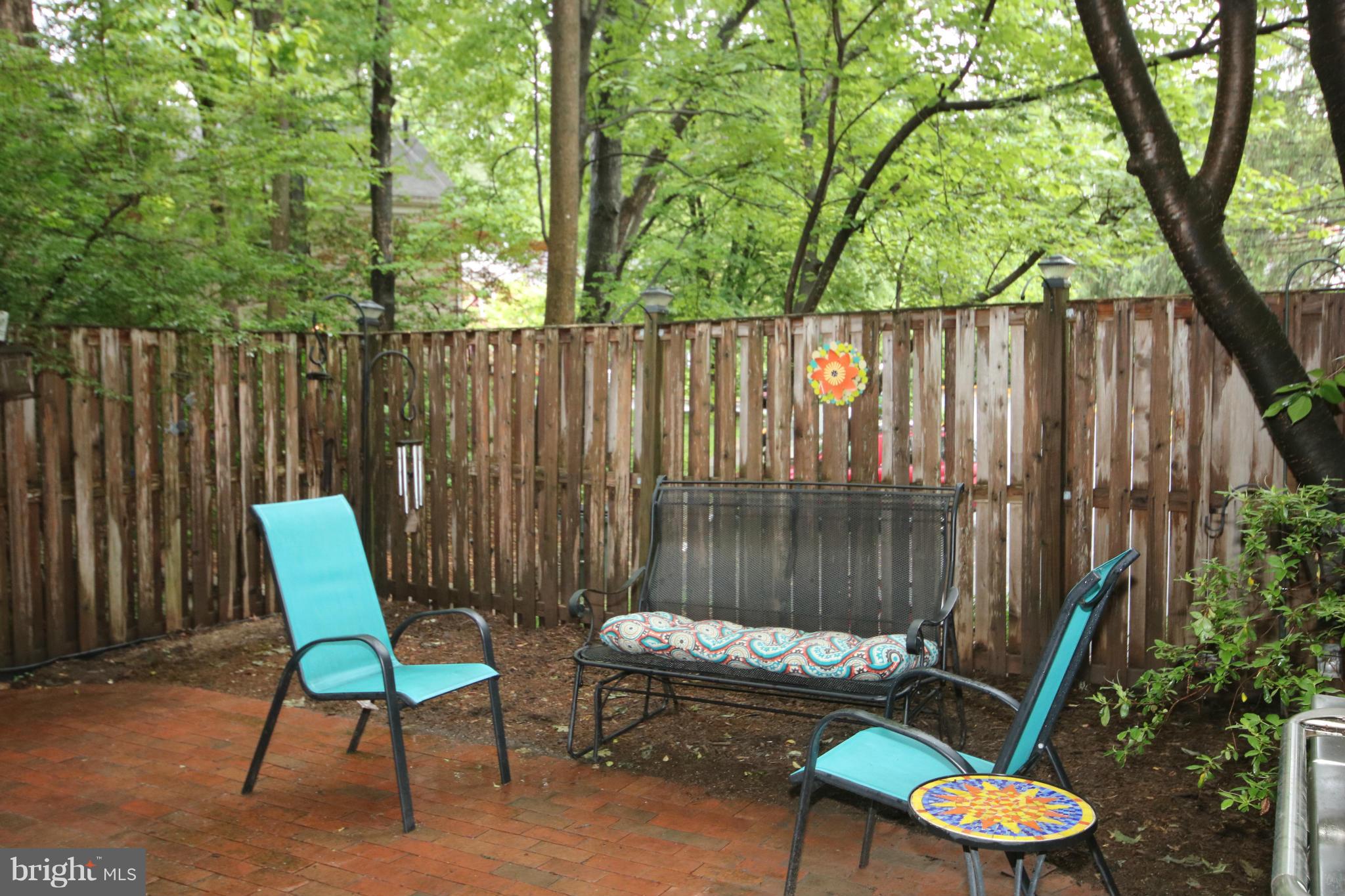 2408 Albot Road Reston, VA 20191 - Photo 26 of 29 Tranquil Brick Patio Amidst Trees