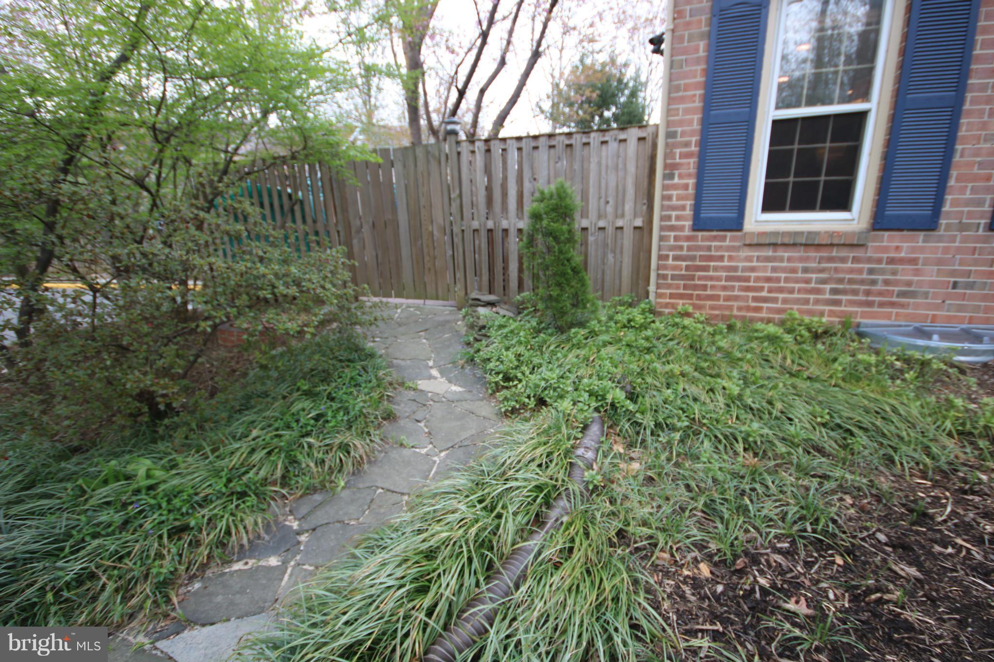 2408 Albot Road Reston, VA 20191 - Photo 28 of 29 Flagstone walkway to fenced rear w/patio