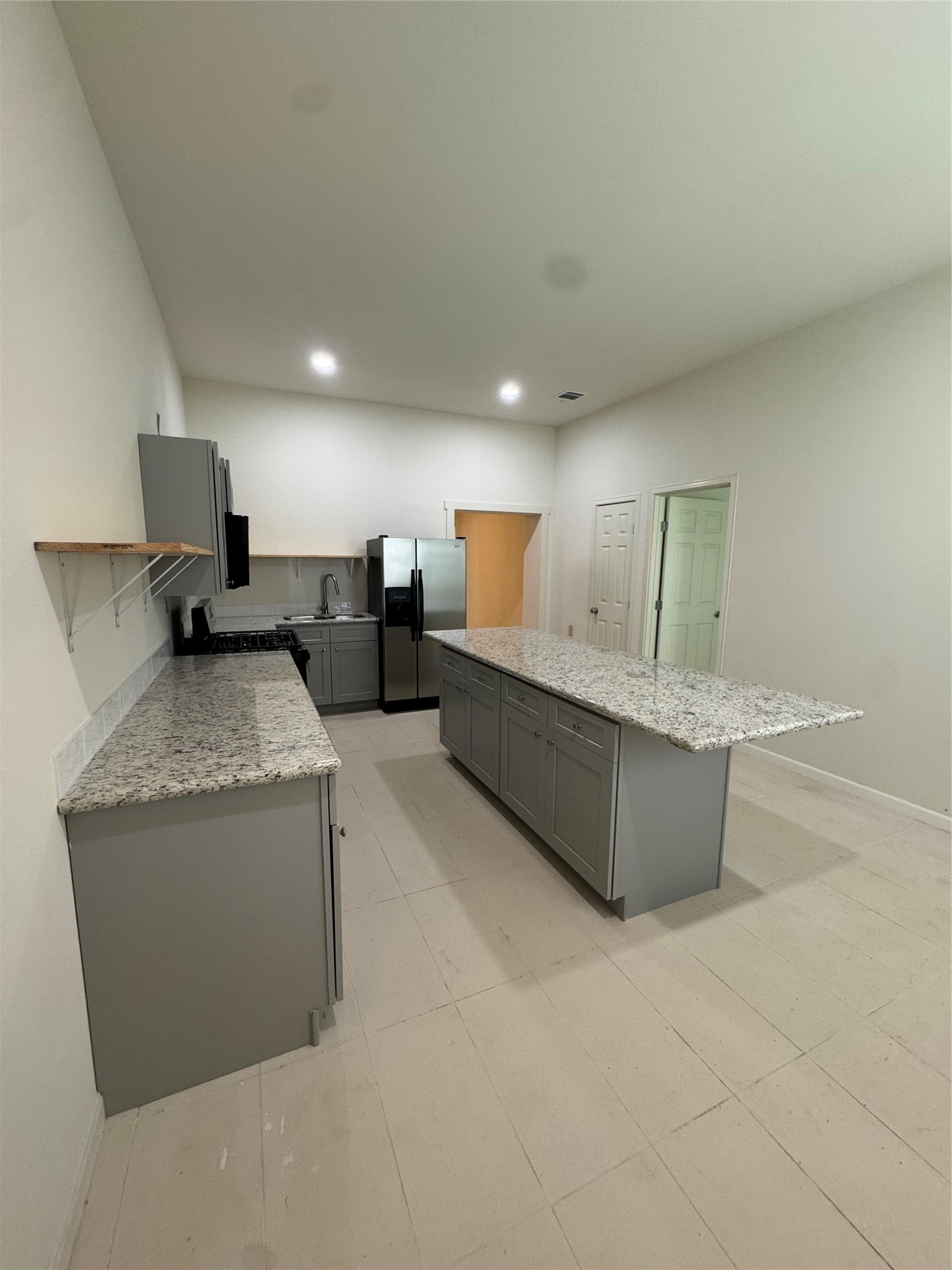 1443 Willow Rock Road Houston, TX 77088 - Photo 14 of 27 a living room with granite countertop furniture and a couch