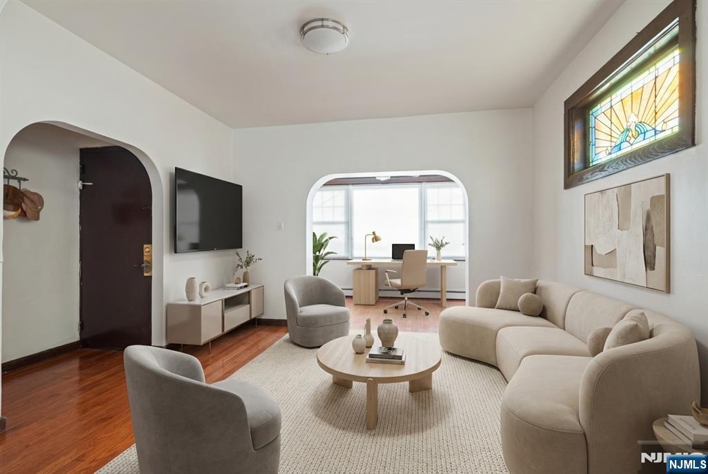 436 Undercliff Avenue Edgewater, NJ 07020 - Photo 2 of 33 a living room with furniture fireplace and a large window