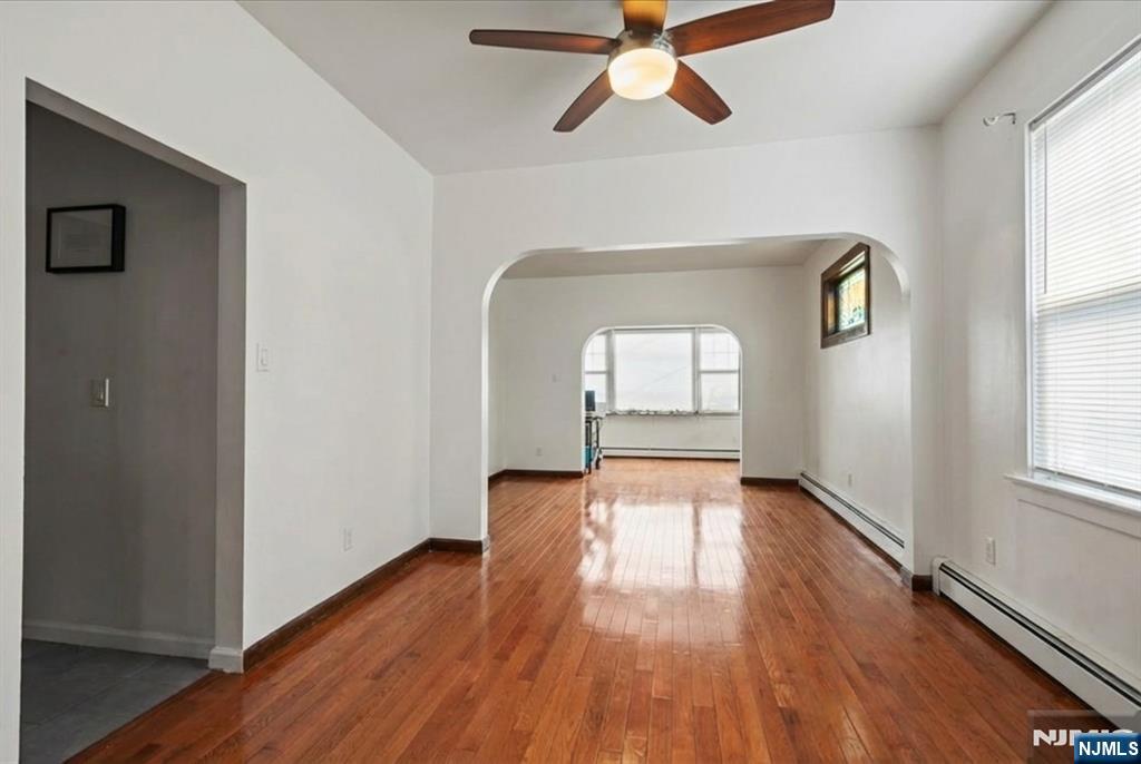436 Undercliff Avenue Edgewater, NJ 07020 - Photo 4 of 33 a view of empty room with wooden floor and fan