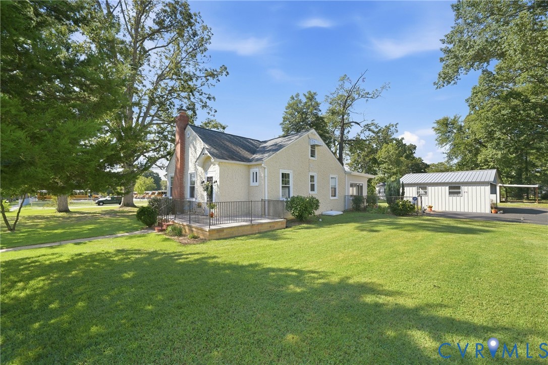 2406 McRae Road Richmond, VA 23235 - Photo 36 of 40 The expansive green lawn complimented by an oversi