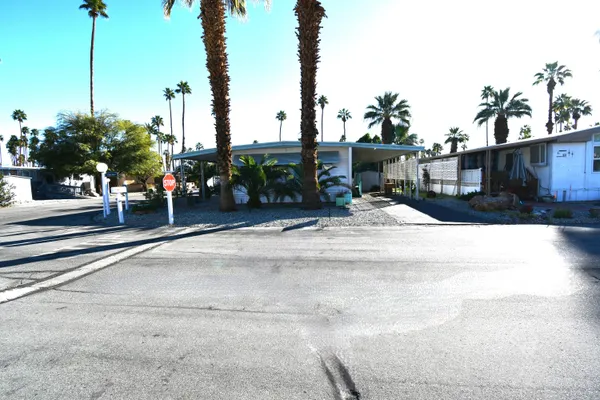 a view of a street with cars parked