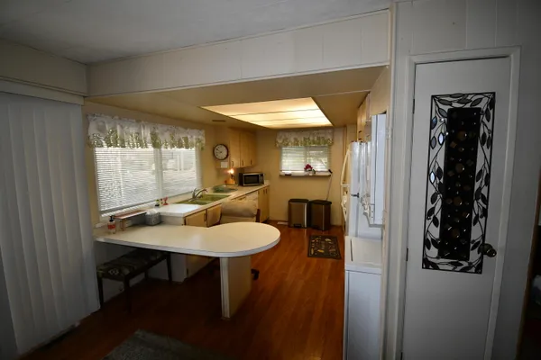 a view of a dining room with furniture and window