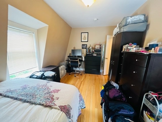9 Rice Street, Unit 5 Brookline, MA 02445 - Photo 3 of 8 a bedroom with two beds and a closet